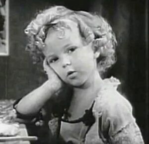 Shirley Temple, "Glad Rags to Riches." Public domain.