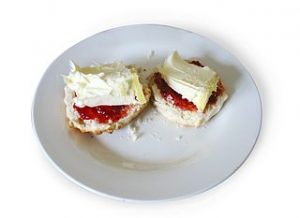 Scones with clotted cream and jam. Note crumbs. What a mess.