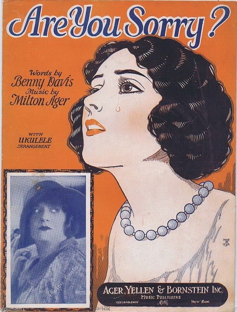 A vintage illustration on the cover of a piece of sheet music depicts a woman with bobbed hair and pearls looking up, a tear rolling down her cheek. An inset photograph shows a woman in a giant hat and dark lipstick. Her expression looks possibly angry.