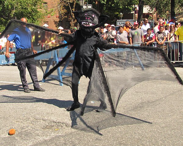 Person costumed as a bat or maybe a spider in the 2010 West Indian American Day parade in Brooklyn, NY.